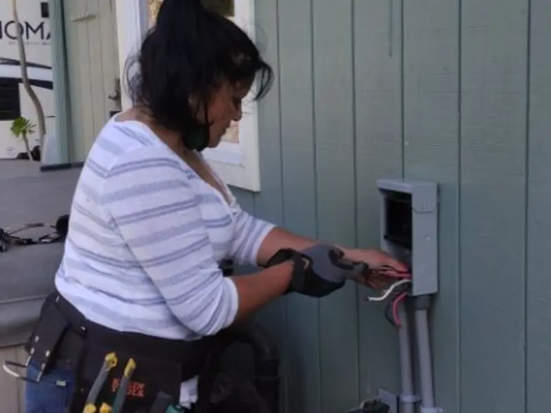 Licensed electrician wiring an exterior subpanel in Lynchburg