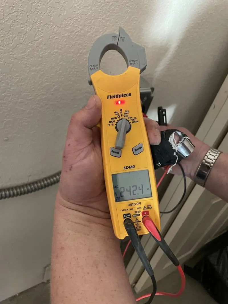 Voltage testing with clamp meter during Whole House Surge Protector in Lynchburg